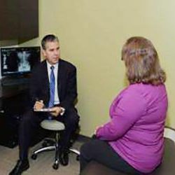Chiropractor Merrillville IN Robert Kauffman with Patient Chiropractor Merrillville IN Robert Kauffman with Patient